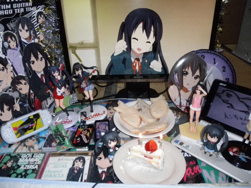 2d_dating birthday black_hair cake cat_pose cd cellphone clock computer figure food game highres k-on! lonely long_hair monitor nakano_azusa nendoroid phone photo psp school_uniform smile taiyaki twintails